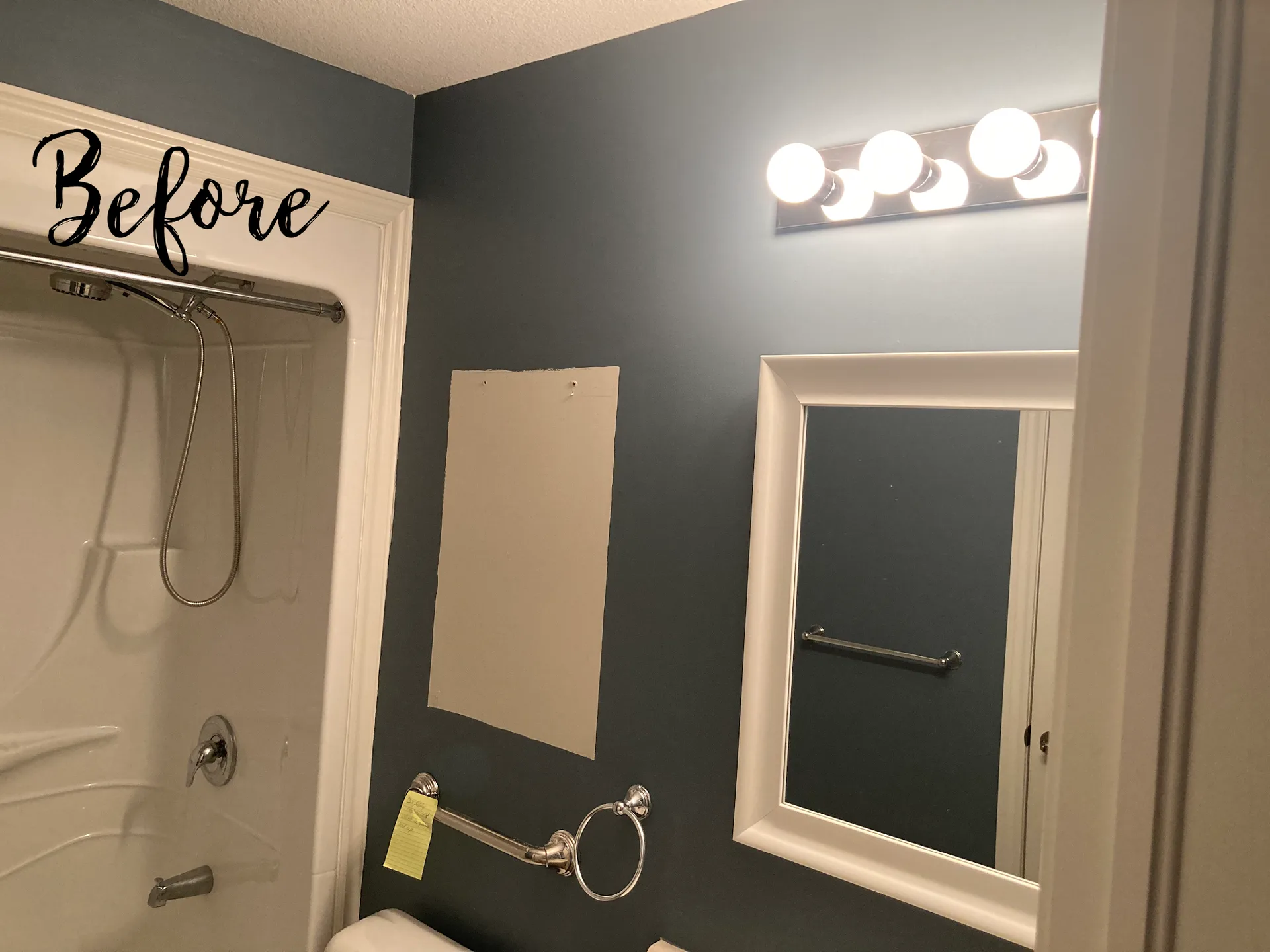Bathroom with deep blue walls before repainting