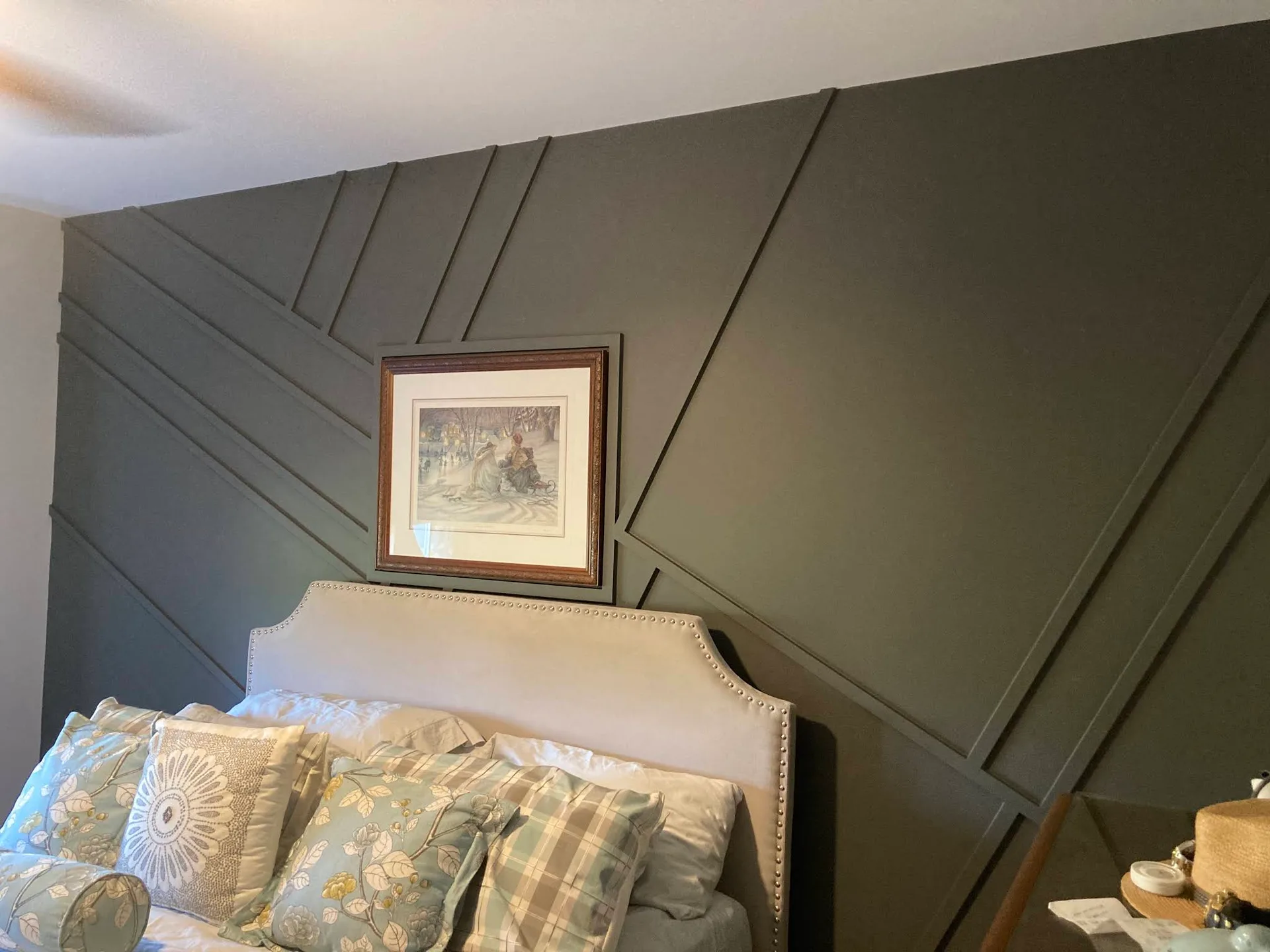 Bedroom feature wall with geometric painted moulding
