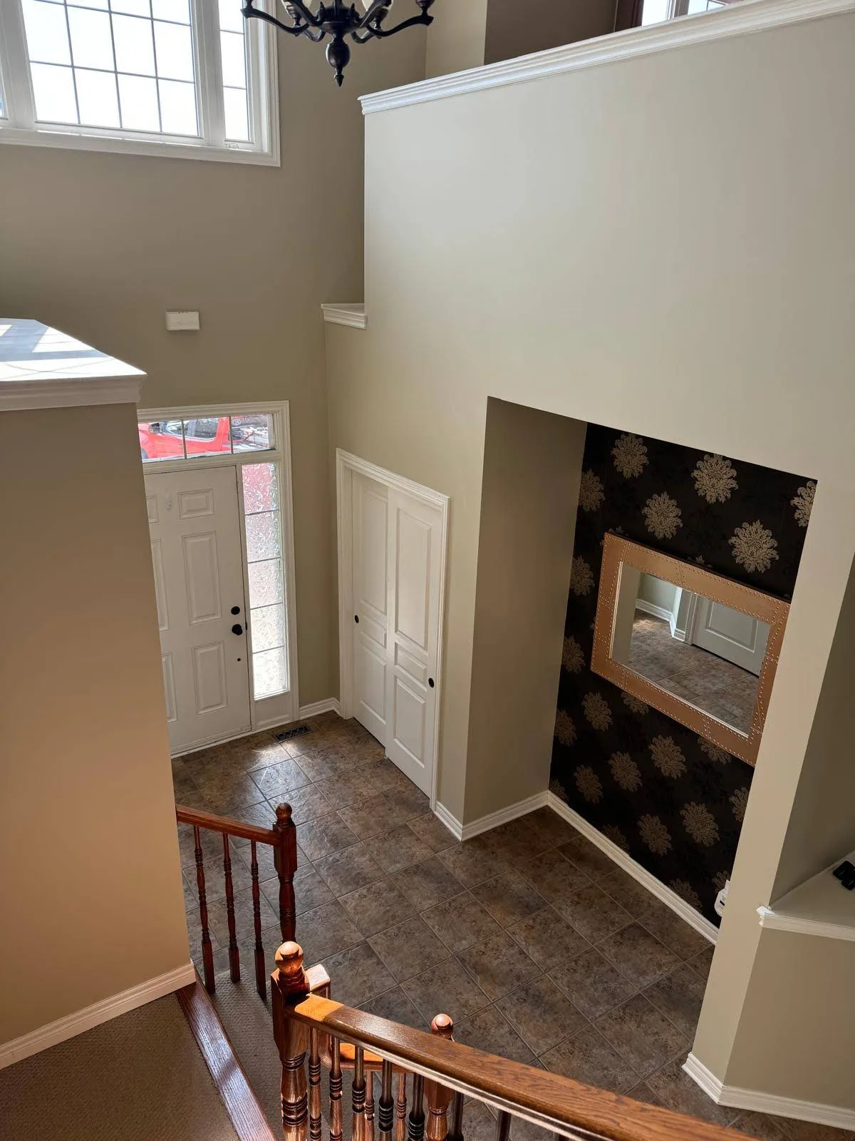 Two-storey front entranceway freshly painted in soft neutrals