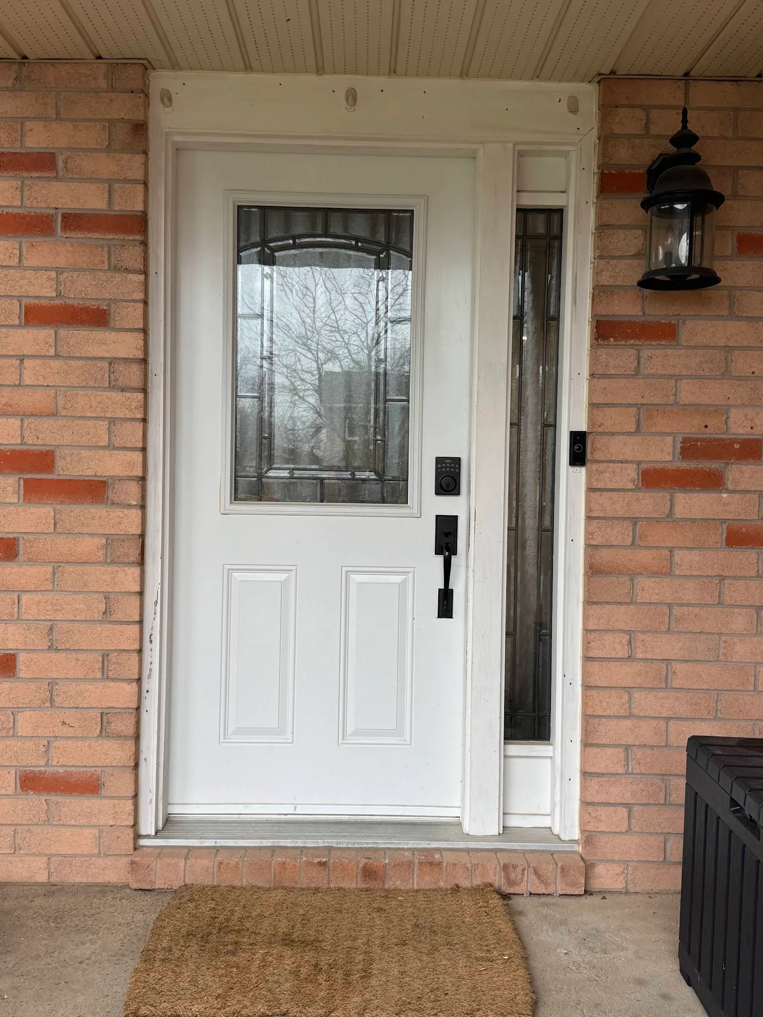 White exterior entry door with refreshed trim