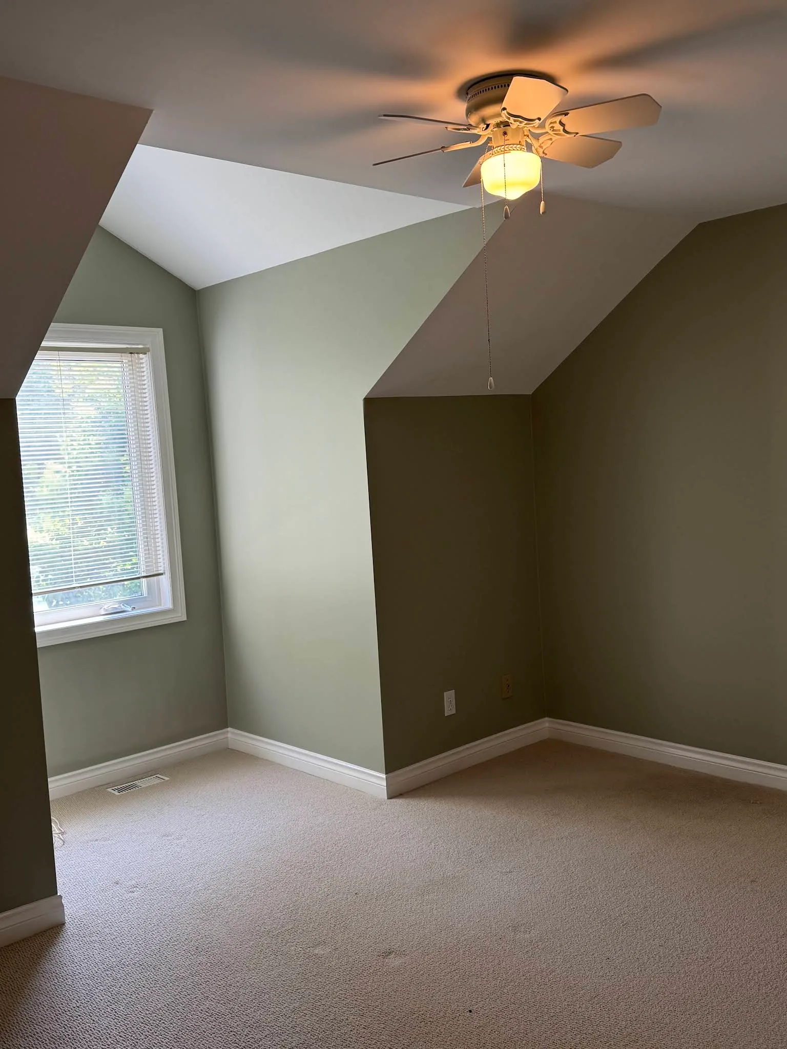 Small bedroom with coordinated green-grey feature walls